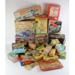 Toy boxes. A collection of approximately twenty-five empty original and reproduction cardboard boxes