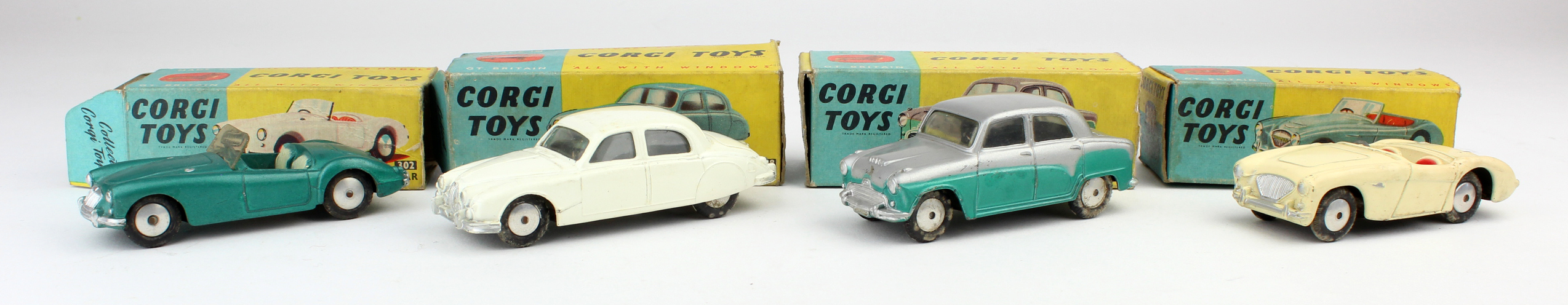 Corgi Toys. A group of four Corgi toys, comprising Austin Cambridge Saloon (201); Jaguar 2.4 Litre