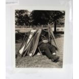 Social History, 16 x 20" photograph of a Hyde Park attendant asleep under a stack of deck chairs,