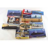 Model Kits. A collection of twelve model kits, including aeroplanes, cars, submarines etc., makers