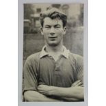 Ken Morgans of Manchester United FC postcard sized photo, RP, by Wilkes with back stamp c1957.