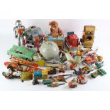 Tinplate toys. A collection of approximately twenty-five original and reproduction tinplate toys,