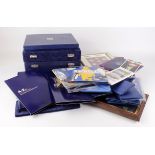 GB & Commonwealth commemorative coins, sets, and accessories in a bag and stacker box.