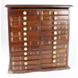 Antique mahogany chest of 24 small drawers; useful for coins, medals or artefacts. Some damage.
