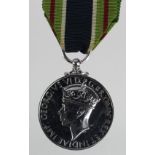 Colonial Police Forces Medal for Gallantry, GVIR issue. Name erased and rhodium plated. A very