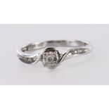 9ct white gold diamond solitaire ring in wraparound design with diamond shoulder accents, finger