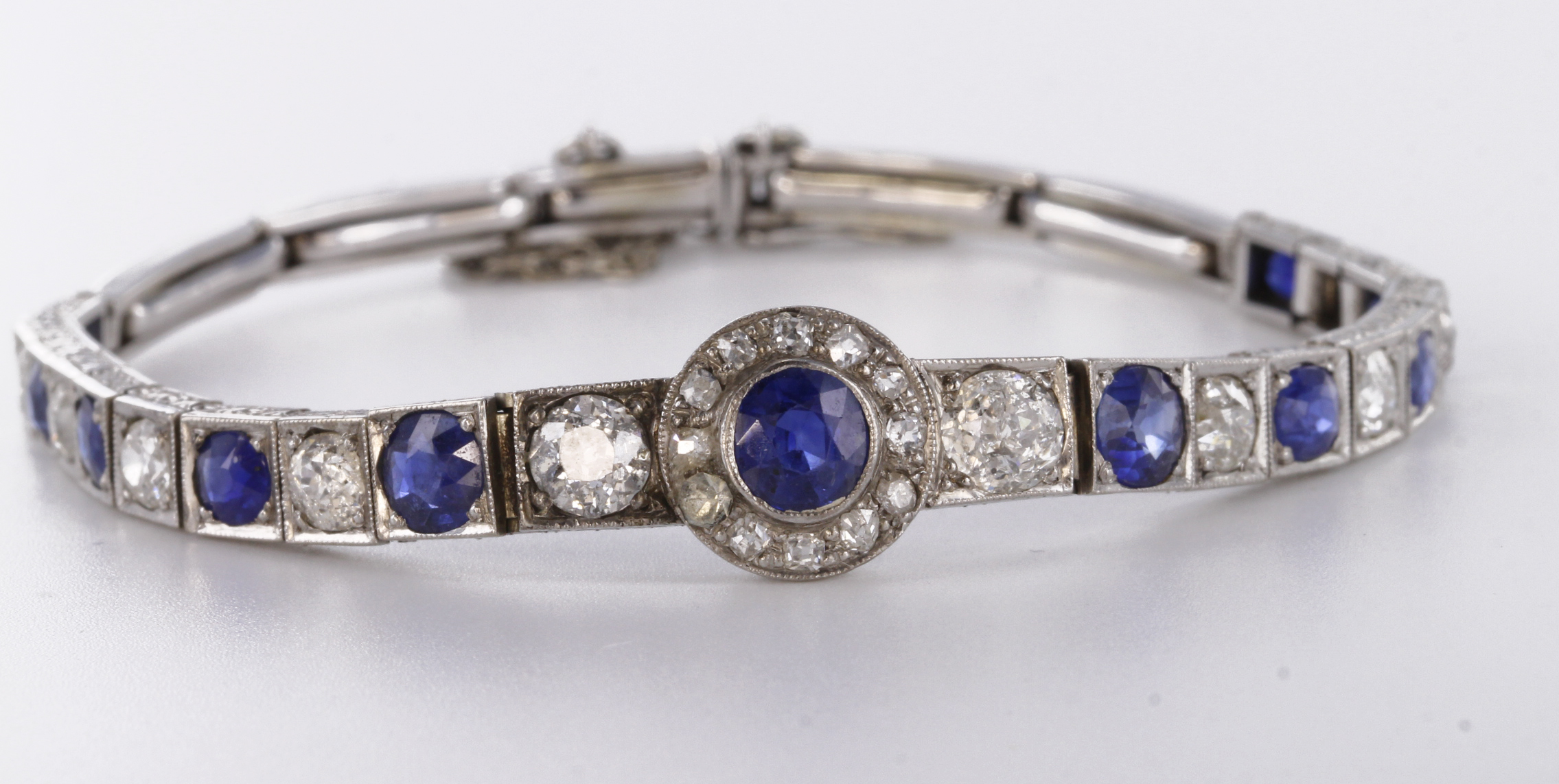 Tests as approx. 18ct white gold sapphire and diamond linked bracelet. This impressive bracelet