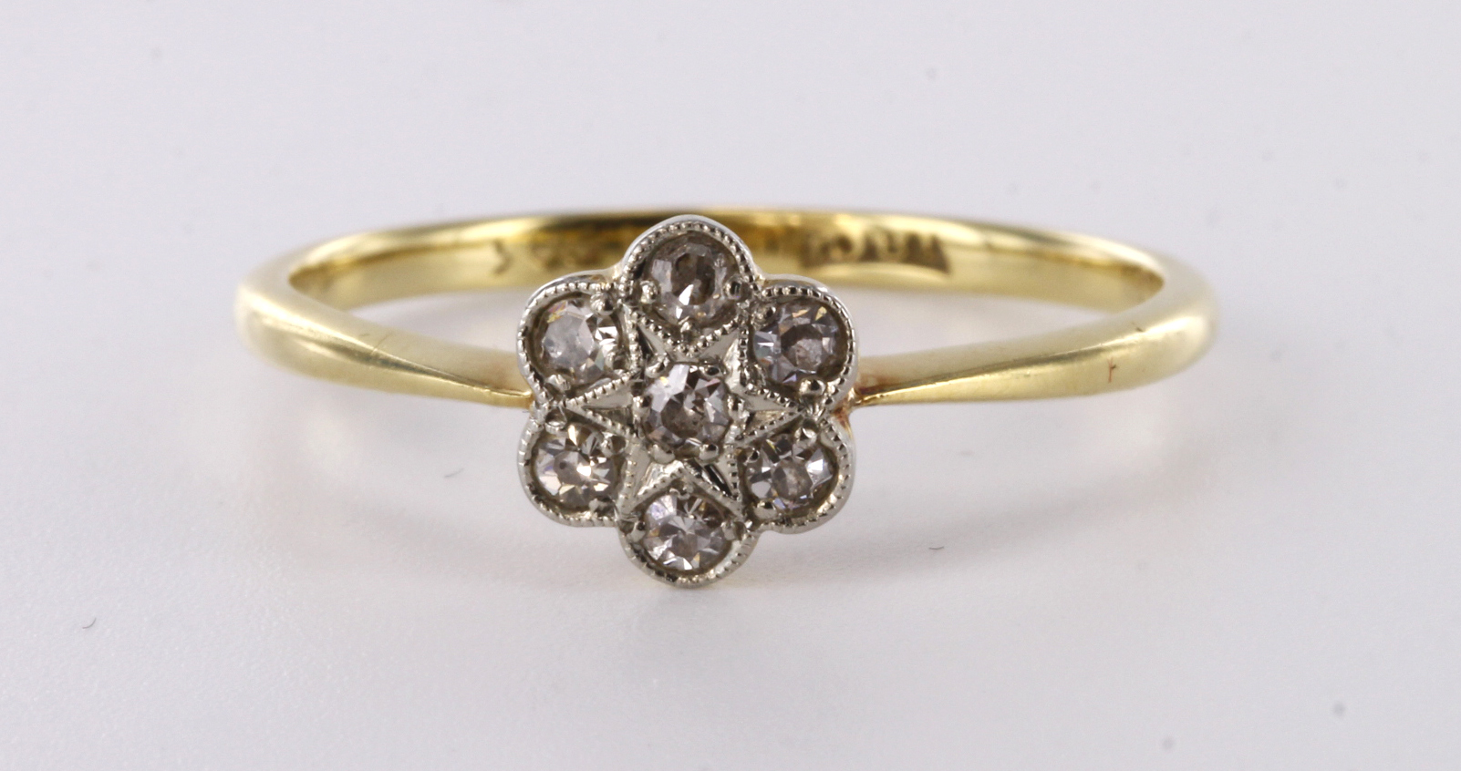 18ct stamped Gold Floral style Diamond Ring size O weight 2.0g