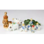 Nine Irish Wade Pottery Characters, comprising six Leprechaun figures, two on pigs, each has a