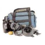 Minolta 9000 camera, with a quantity of accessories, in a carrying case