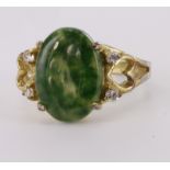 18ct yellow gold oval jadeite dress ring with heart decoration shoulders, finger size P, weight 3.