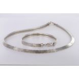 Silver necklace and bracelet suite consisting of flat diamond cut collar style necklace with trigger