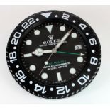 Advertising Wall Clock. Black 'Rolex' advertising wall clock, black dial reads 'Rolex Oyster