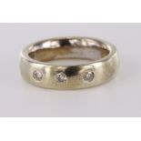 9ct yellow gold 6mm wide band ring set with three diamonds totalling approx. 0.09ct flush set,