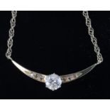 18ct yellow gold diamond set curved bar on a 9ct necklace with principal central diamond approx. 0.