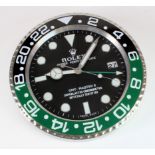 Advertising Wall Clock. Black, green & chrome 'Rolex' advertising wall clock, black dial reads '