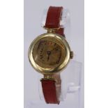 Ladies gold plated wrist watch on red leather strap, working when catalogued