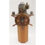 Ships brass binnacle compass, marked 'Patt. 183', mounted on a tall plinth with a ships wheel, total