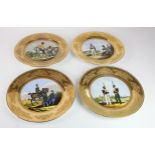 Military interest. Four military themed gilt and hand-painted plates, each depicting soldiers (