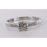 9ct white gold diamond ring set with seven diamonds in a cluster illusion setting and diamond accent