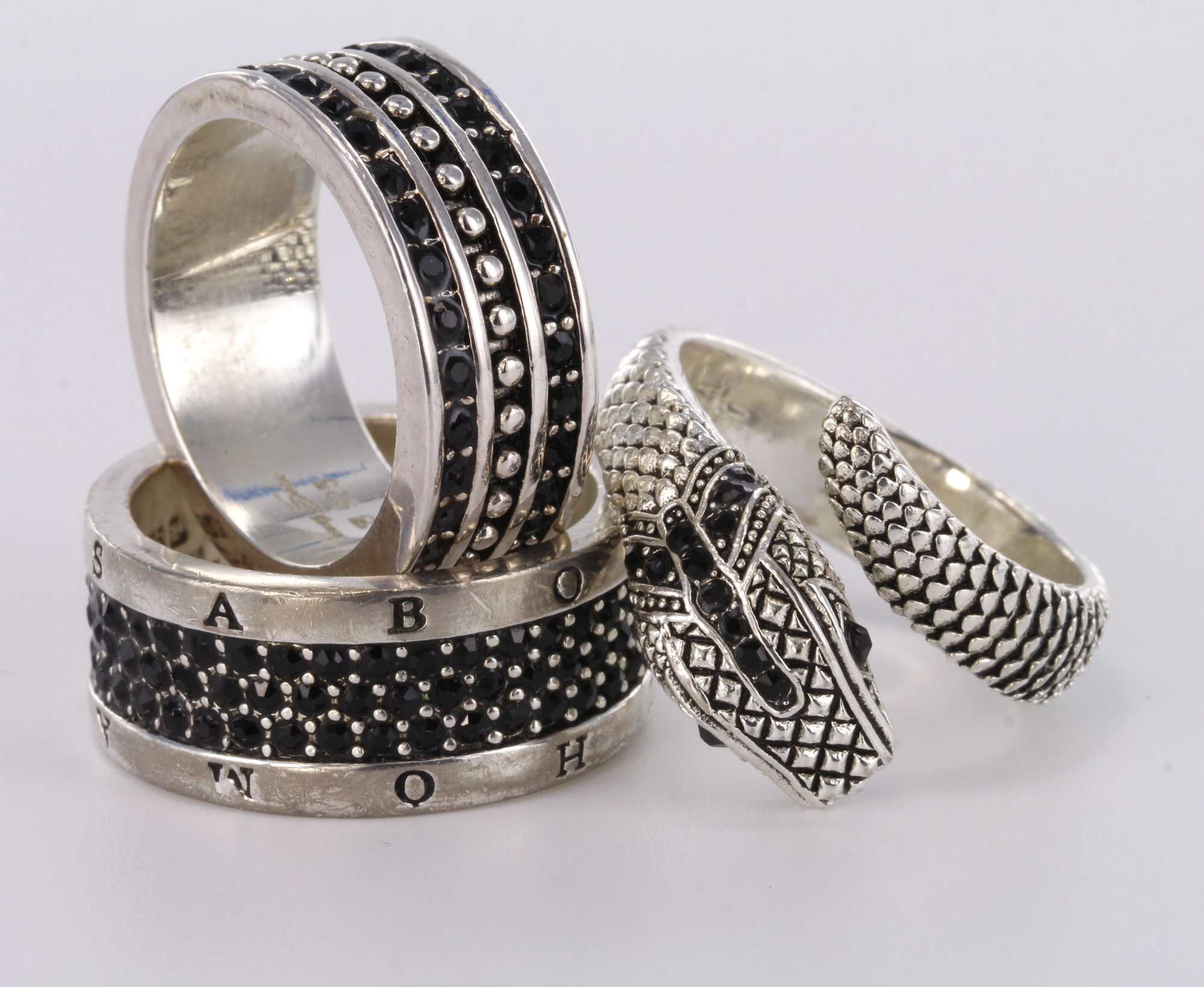 Three silver rings by designer Thomas Sabo, all set with black cz stones. Snake ring, finger size Q,