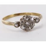 Dainty 18ct yellow gold diamond daisy cluster ring with diamond shoulders, total diamond weight