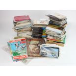 Mixed collection in crate, brass & metal figures, postcards, postal history, jigsaws, football