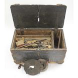 Tool chest containing numerous old tools, including planes, chisels, clamp, brace, grinder, etc.,