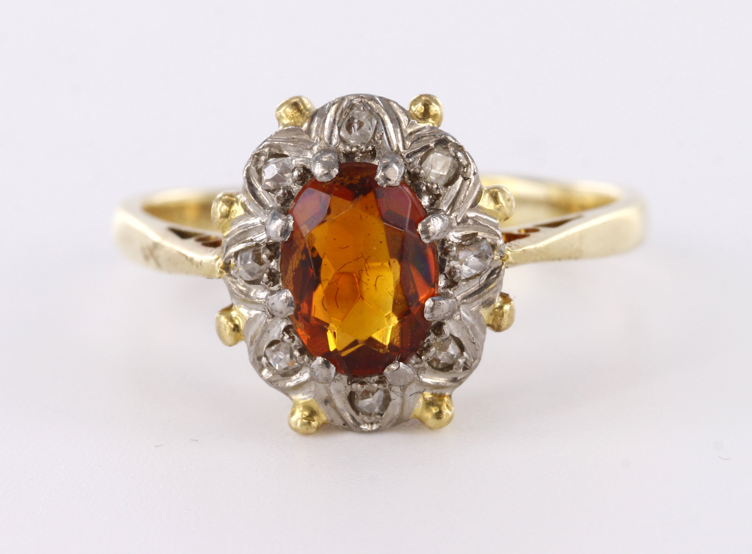 9ct yellow gold cluster ring set with central oval topaz with diamond accent surround, finger size