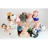 Ceramic Money Boxes. A collection of twenty-one ceramic money boxes (some Wade), including seven
