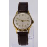 Midi sized gold plated Kienzle manual wind wrist watch on brown leather watch strap, champagne