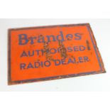 Advertising. An orange & blue double-sided enamel sign 'Brandes Authorised Radio Dealer', worn (