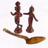 Two metal Oriental figures (partly covered in red paint), circa late 19th to early 20th Century,