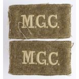 Cloth Badges: M.G.C. - Machine Gun Corps pair of WW1 slip-on shoulder title badges in excellent worn