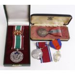 Mixed lot of 4 medals comprising a silver Army Temperance Assoc. 4yr. Medal, a silver 1935 silver