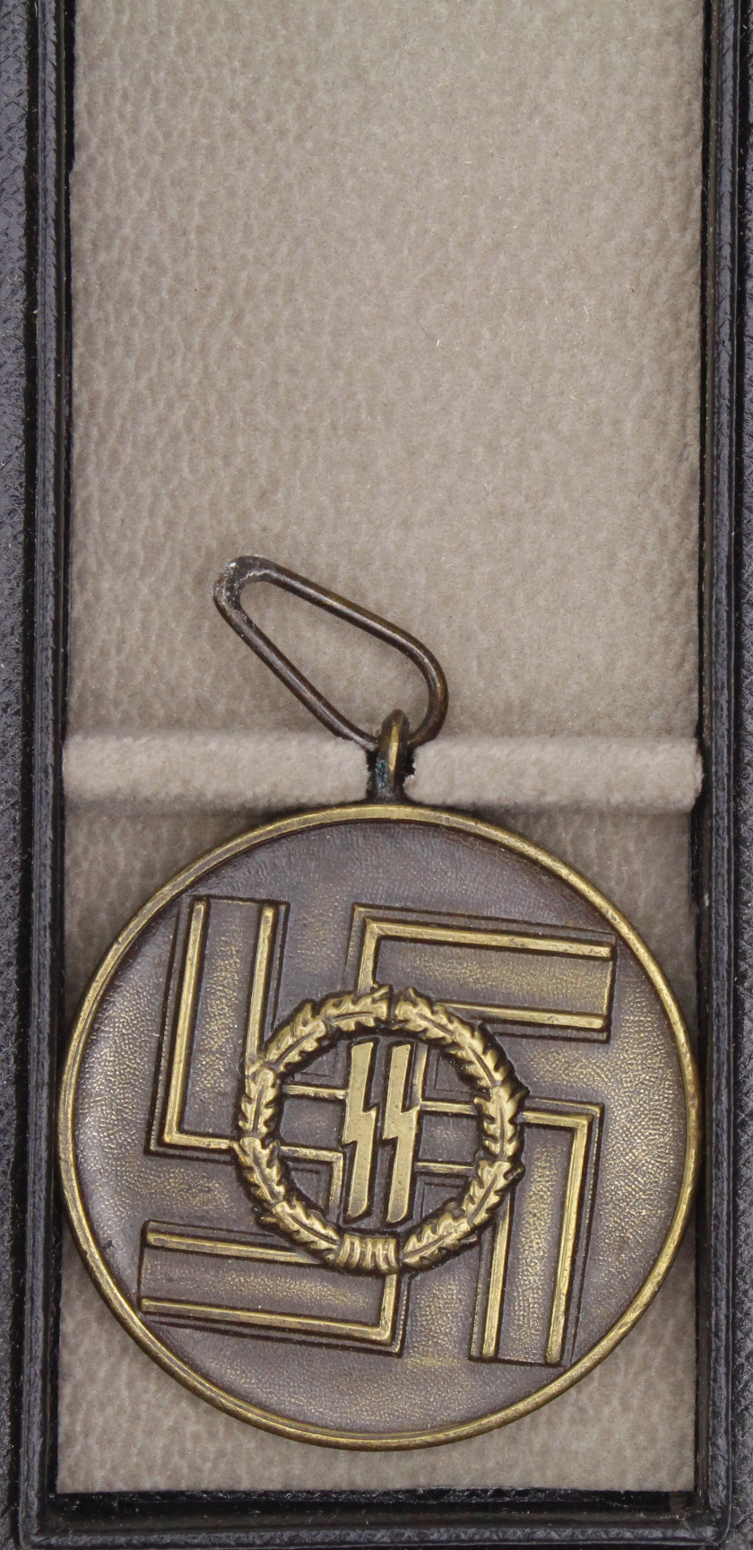 German 8 Year Service medal in case of issue.