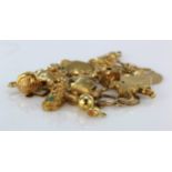 Quanity of 9ct/Yellow metal charms. Total weight 30.5g