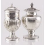 Two Georgian silver peppers, hallmarked for London, 1799 and 1818. The urn-shaped pepper has
