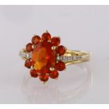 9ct yellow gold fire opal cluster ring with diamond accents, finger size L, weight 2.2g