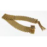 9ct yellow gold seven row panther link bracelet with a sapphire set adjustable clasp and tassle