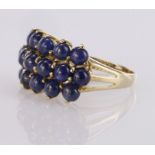 9ct yellow gold dress ring set with three rows of sapphire cabochons, finger size R, weight 4.9g