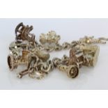 Silver / white metal charm bracelet with a good quantity of charms attached. Approx 58.4g