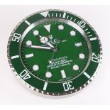Advertising Wall Clock. Green & chrome 'Rolex' advertising wall clock, black dial reads 'Rolex
