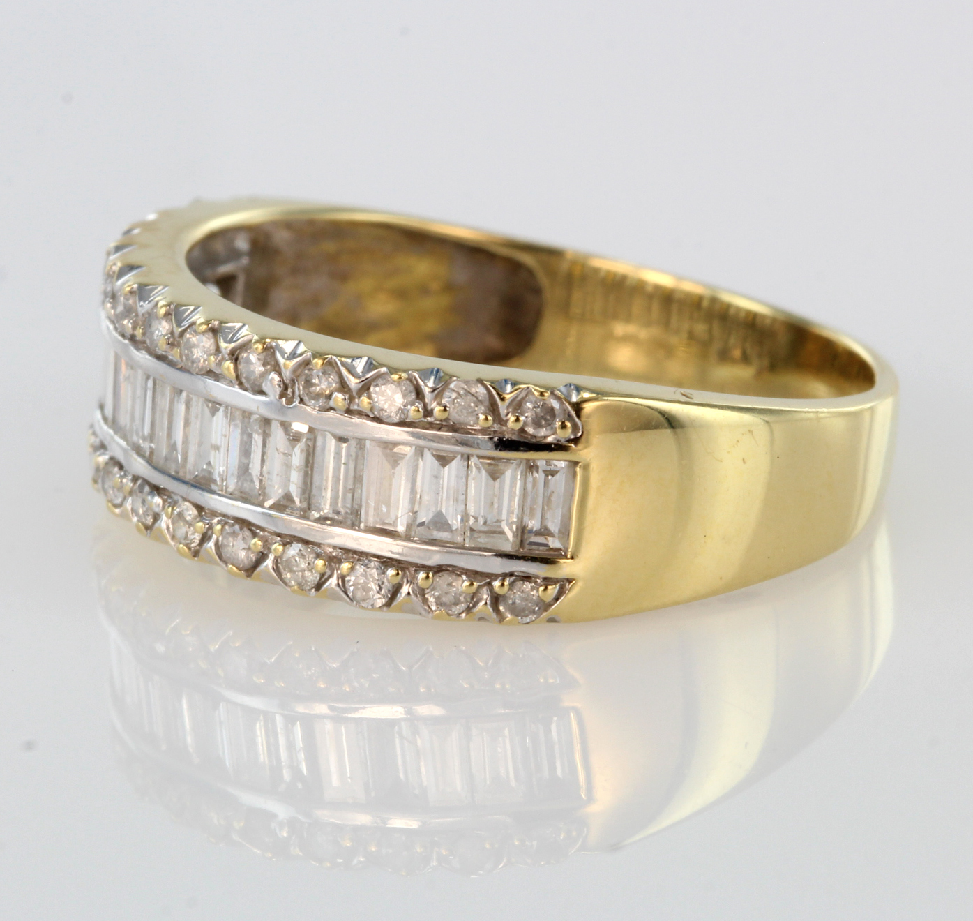 18ct yellow gold band ring set with row of baguette cut diamonds bordered by a row of round diamonds - Image 2 of 2