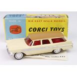 Corgi Toys, no. 219 'Plymouth Sports Suburban Station Wagon' (cream body / brown roof), contained in
