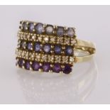 9ct yellow gold wide band ring set with three rows of amethyst iolite and tanzanite separated by two