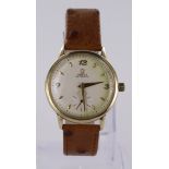 Gents 14ct gold Omega automatic wristwatch. The cream dial (some greenish toning towards right-