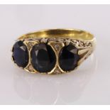 9ct yellow gold garnet graduated three stone ring with diamond accents, finger size S, weight 3.3g