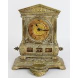 Brass desk clock with intergrated calendar and inkwell, height 22cm, width 18cm, depth 14cm approx.