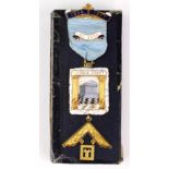 Masonic interest. A 9ct gold, silver gilt & enamel jewel / medal, engraved to reverse 'Presented